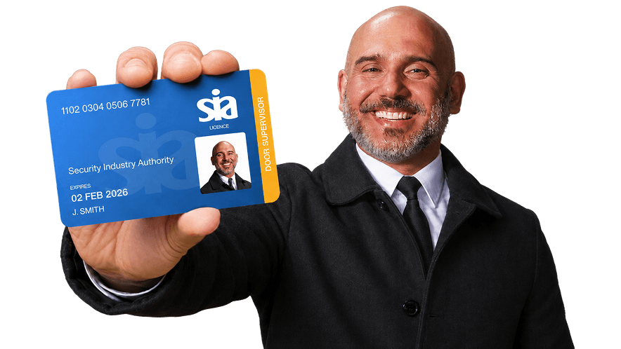 Man holding an SIA licence card